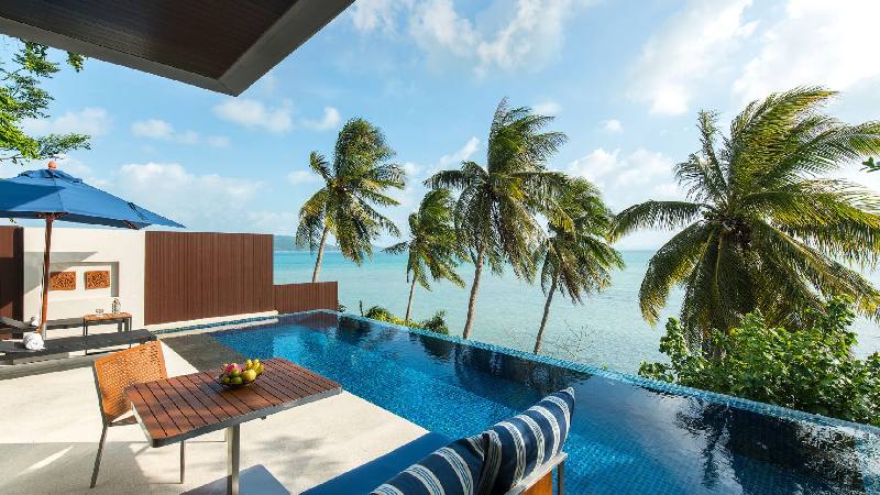 Private villa terrace with infinity pool and tropical ocean view