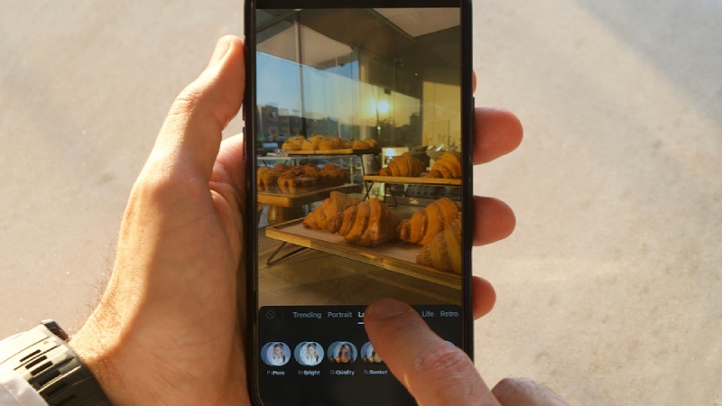 A person scrolling through social media on a smartphone